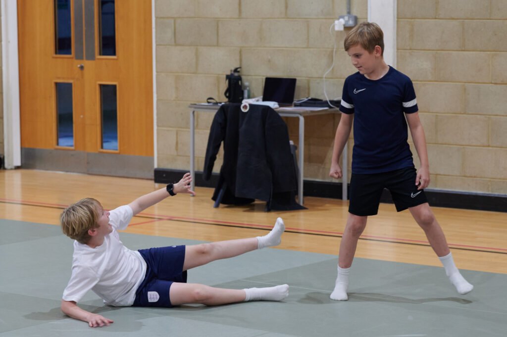 Child defending himself when he is on the ground.